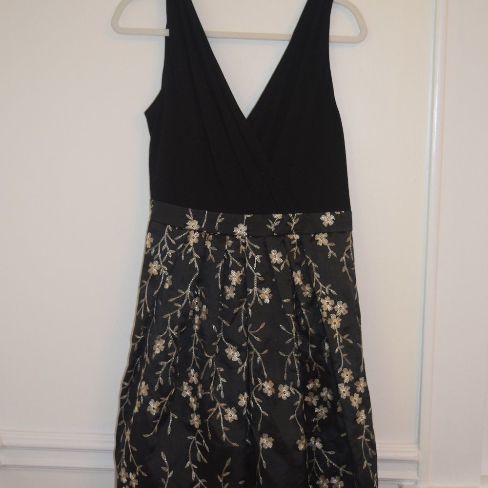 Black cocktail dress w/ gold flower detail